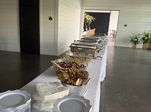 Buffet presentation with serving dishes and place settings
