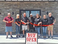 Restaurant exterior during the opening ribbon cutting