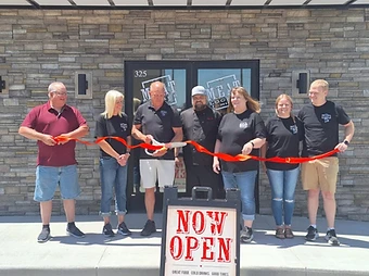 The Meat Locker opening ribbon cutting outside the Blairstown restaurant