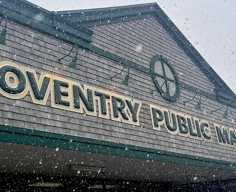 Coventry Public Market storefront with cedar-shingle siding and green trim