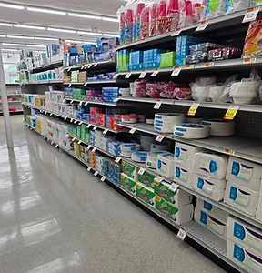 Market aisle with paper products and household essentials