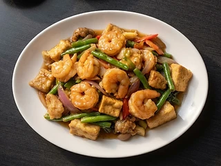 Concept photograph of a Chinese shrimp, tofu, and vegetable entrée