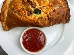 Folded oven-baked favorite served with tomato sauce