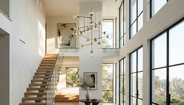 Illustrative example of a modern chandelier installed in a home entryway