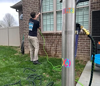 Pure-water filtration system in action on a brick home