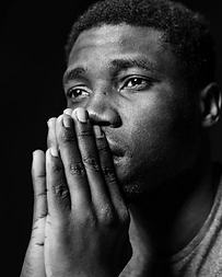 A member in reflection during an inside sangha meeting