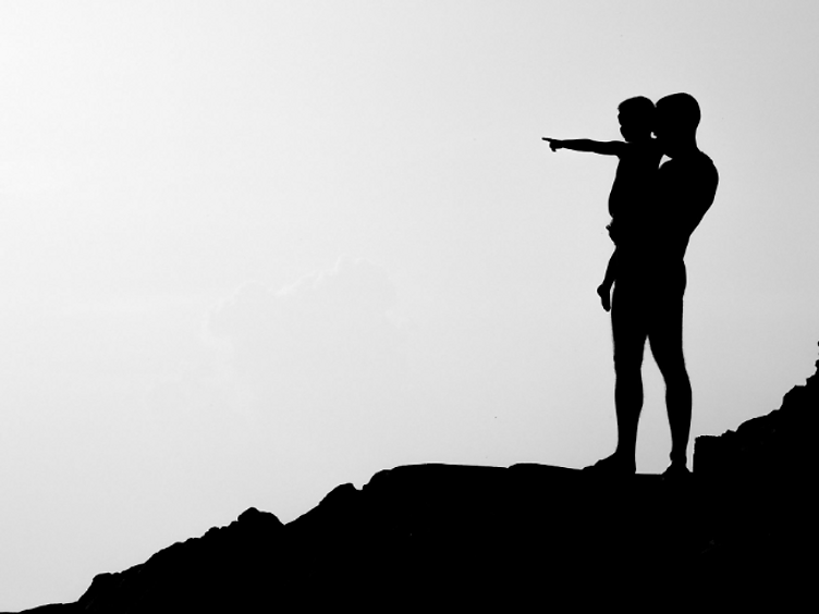 Parenting Ourselves — adult and child silhouette looking toward the horizon