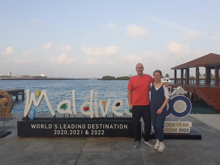 Martin and family at the Maldives sign