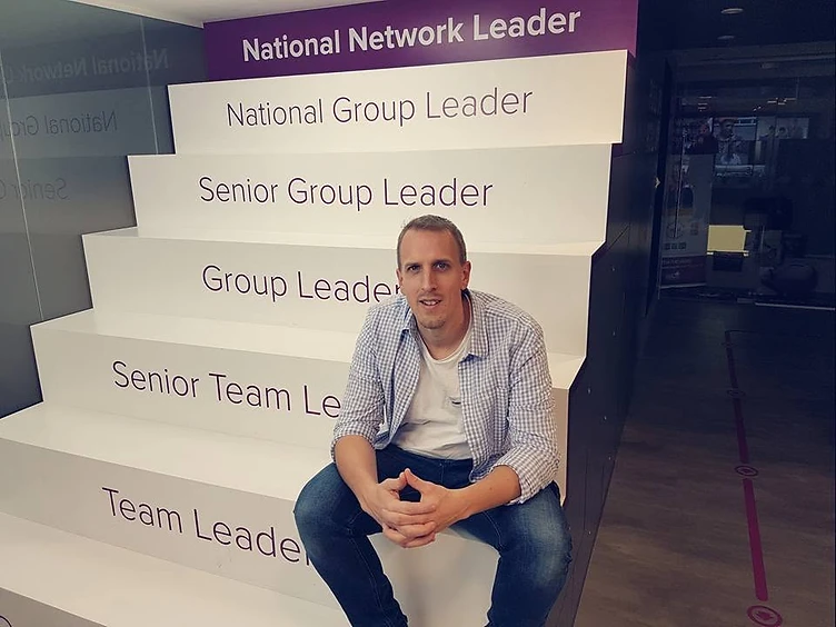 Martin sitting on the career progression stairs
