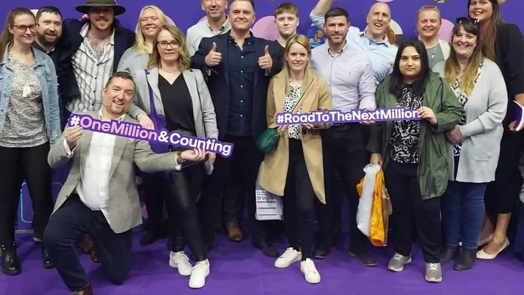 Martin's team celebrating one million customers
