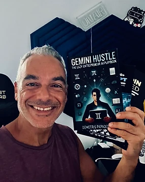 Demetris Papadopoulos holding his book Gemini Hustle