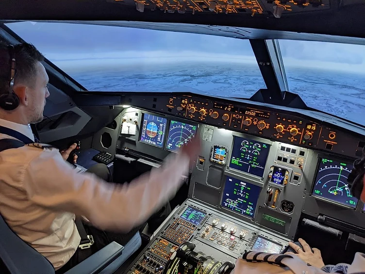 Pilot operating the A320 simulator