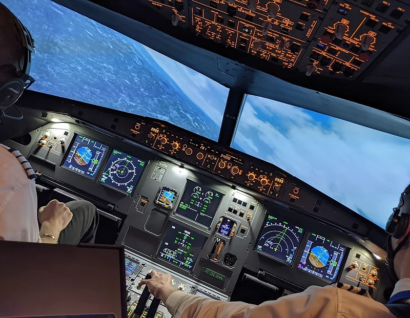 Airbus A320 flight simulator cockpit at night