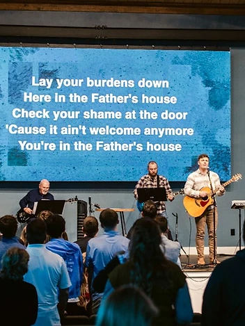 A wide view of the congregation worshipping together on a Sunday morning