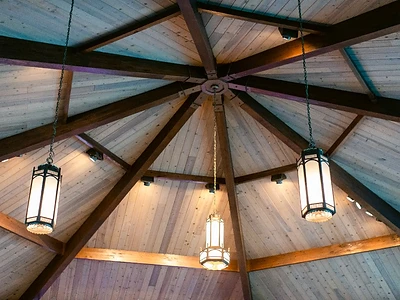 The warm wooden ceiling and lantern lighting inside the Abundant Life sanctuary