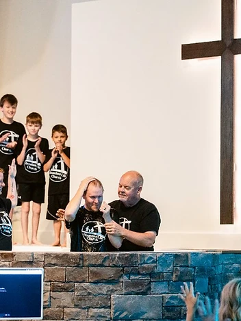 Joyful celebration as a member of the church family is baptized
