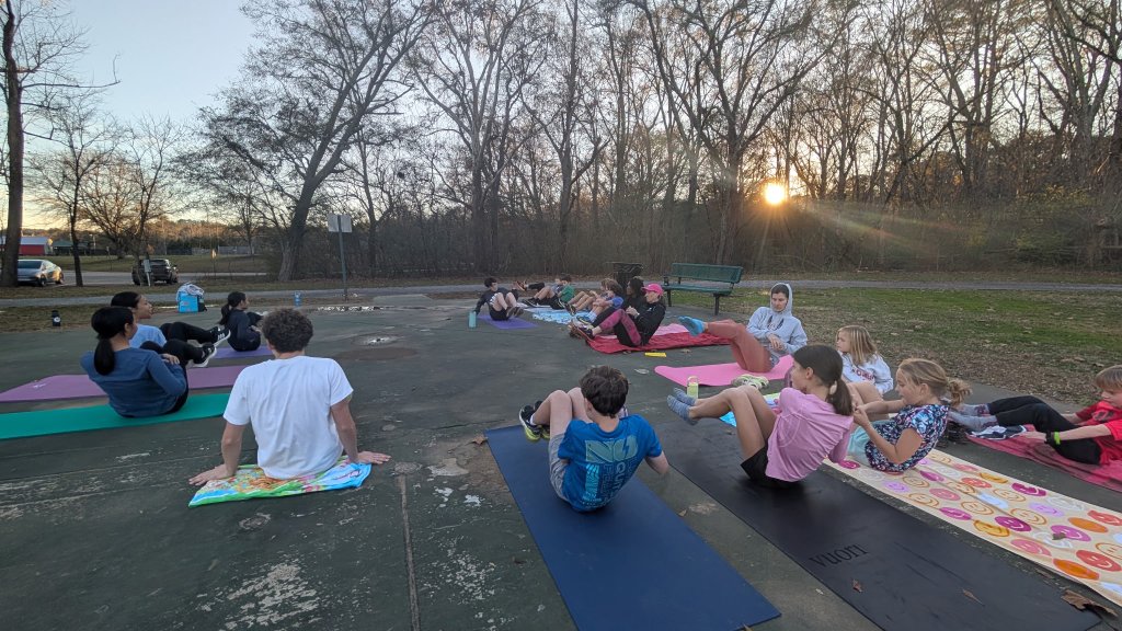 Warriors athletes doing core work together at practice