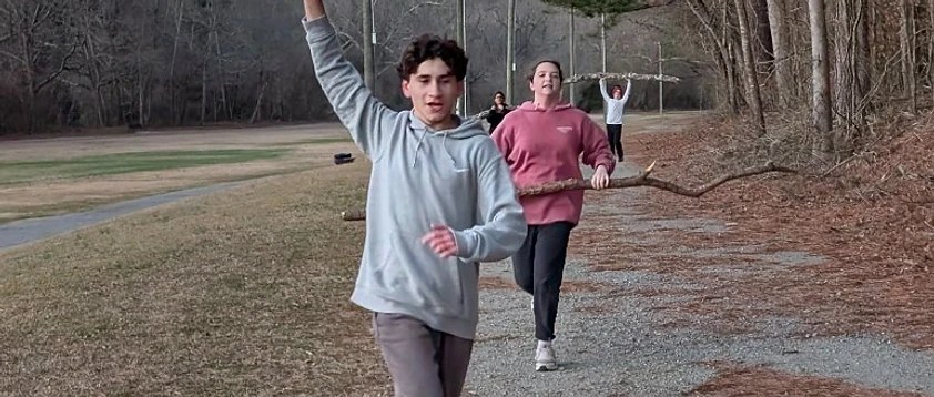 Cherokee Junior Warriors athletes running together at practice