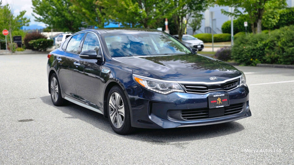 2017 Kia Optima in dark blue, front three-quarter view from the driver side, on a dealer’s lot.