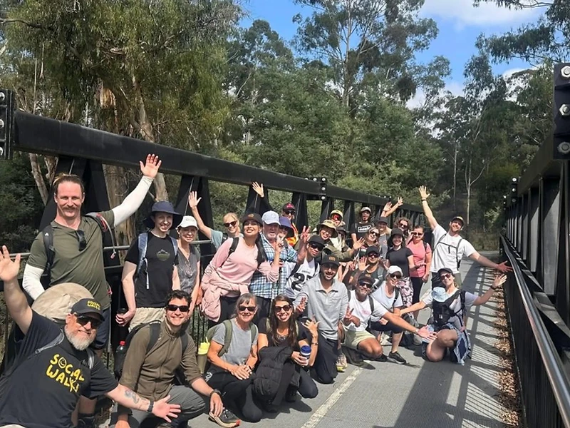 The Social Walks community posing together on a bridge walk