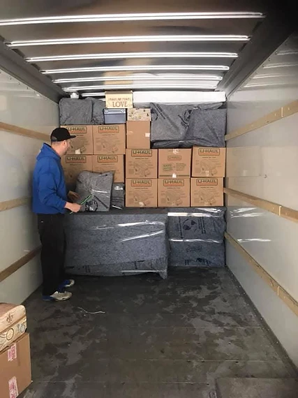 YCML moving labour specialist loading and organizing a moving truck