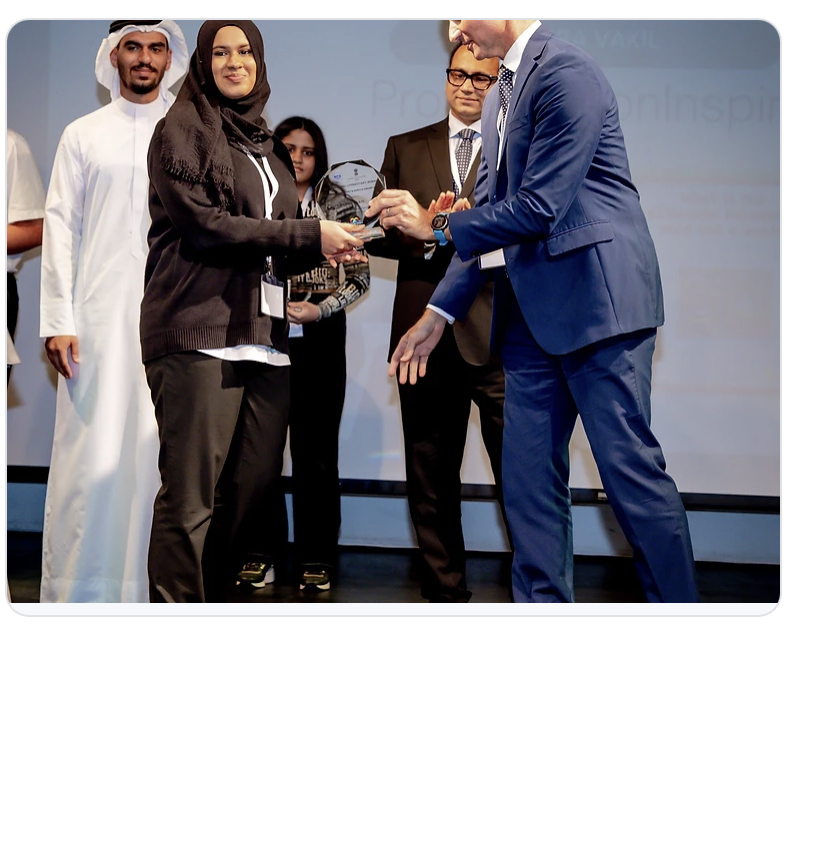 Awardee Zahra Vakil receiving a YES Award from Mr Nic Brain, Principal of Jumeirah College