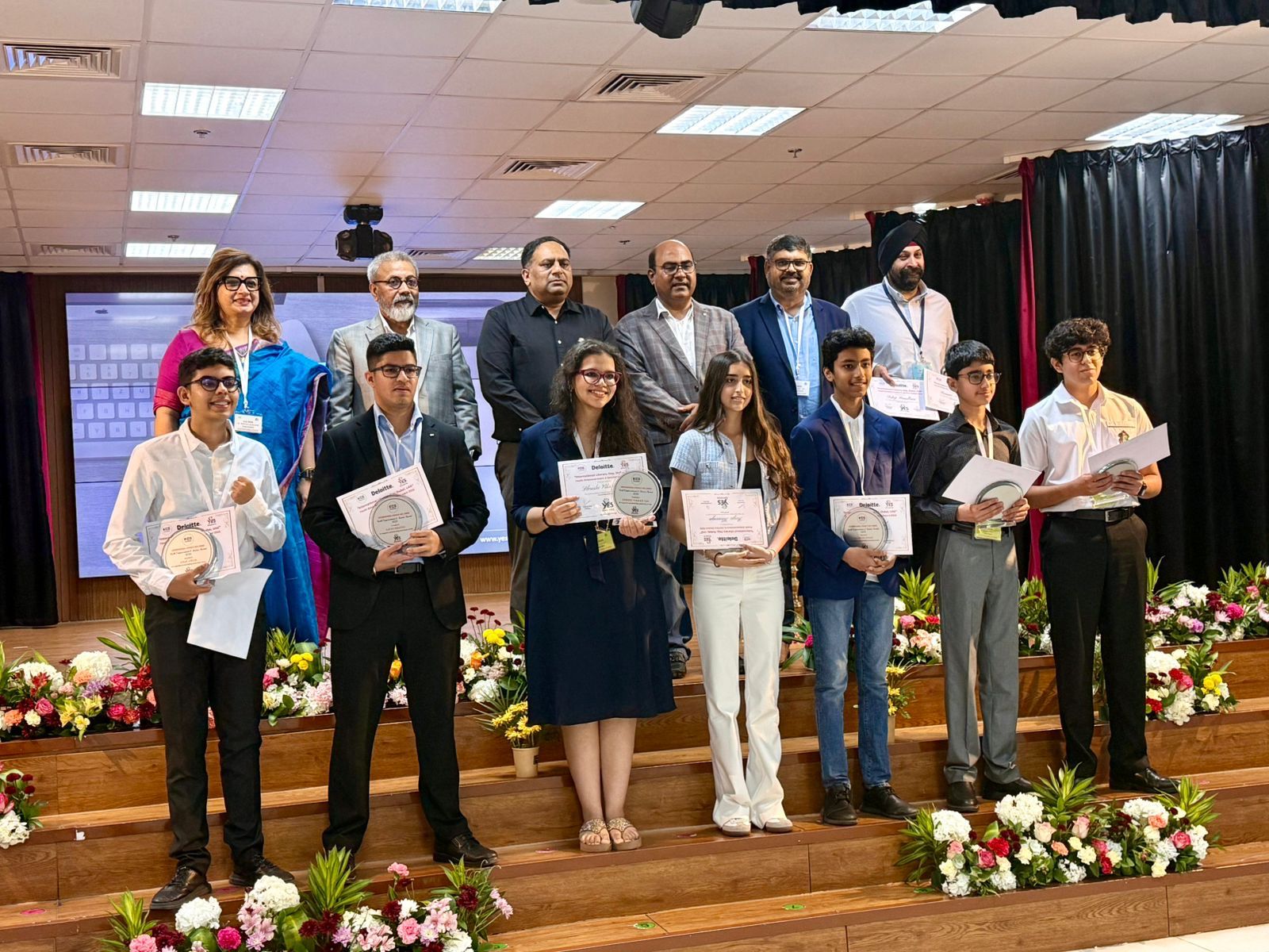 Awardees and dignitaries on stage at the International Literacy Day 2025 ceremony