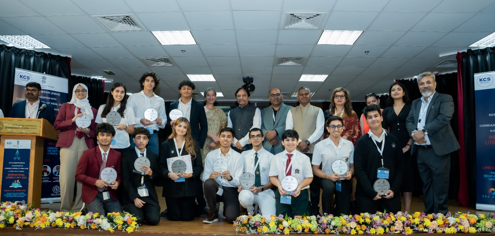 Group photograph with KCS Foundation and Consulate General of India banners at ILD 2024
