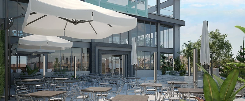 Steel Restaurant and Café design in Irbid with a glazed steel façade, landscaped terrace, and outdoor dining seating
