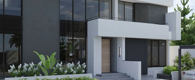 R.E Villa in Baghdad with crisp white and charcoal architecture, large windows, landscaped entrance and layered green planting