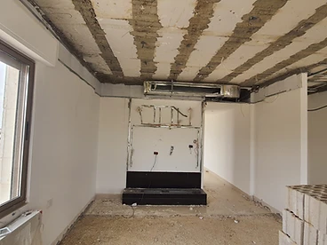 Before: wall niche, duplex interior design, Amman: exposed wiring above an unfinished base