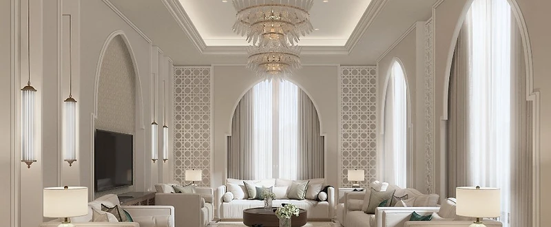 M.S Residence formal reception room in Jeddah with tall pointed arches, patterned screens, ivory seating and layered chandeliers
