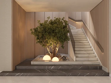 Olive Court Residence in Amman featuring a marble stair, warm timber walls and an illuminated indoor olive tree