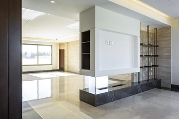After: TV wall, duplex interior design, Amman: fireplace bench in dark marble, steel shelving