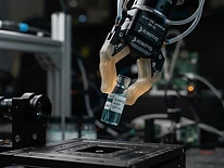 Adaptive gripper on a precision stage