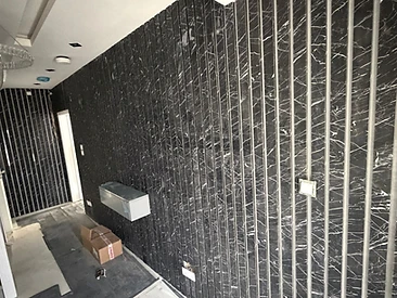 Black Marble Feature Wall in London by Harris Construction