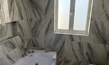 Modern Bathroom with Whirlpool Bath in London by Harris Construction