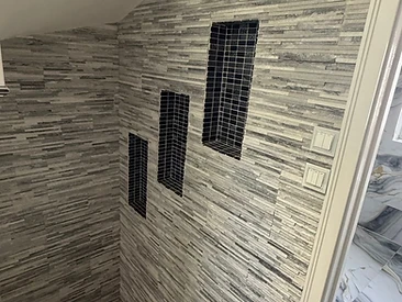 Stone Feature Wall & Niches in London by Harris Construction