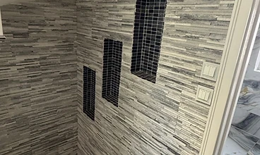 Stone Feature Wall & Niches in London by Harris Construction