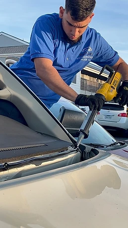 Rodriguez Autoglass technician applying windshield adhesive