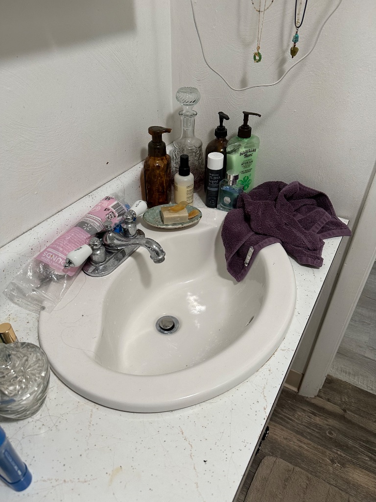 Bathroom vanity before deep cleaning in Southwestern Pennsylvania