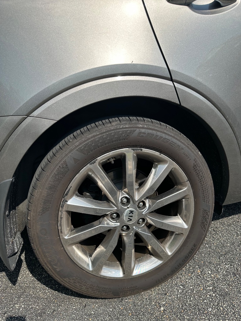 Alloy wheel before exterior detailing in Southwestern Pennsylvania