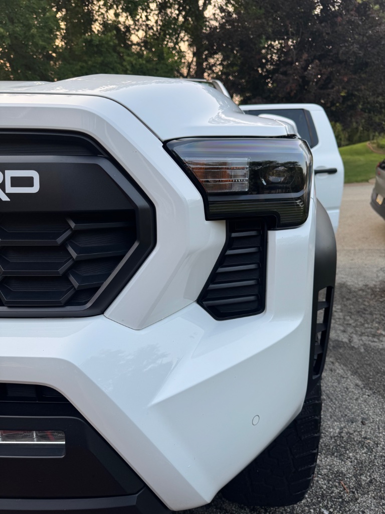 White truck front grille and headlight detail