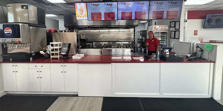 Prime Fried Chicken service counter and kitchen with digital menu boards