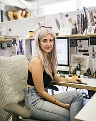Claire, graphic designer and wedding album editor at Dreams Photography, working on post-production and image editing