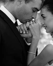Full wedding ceremony photography in Sydney — a groom kissing his bride’s hand in a close-up black and white portrait