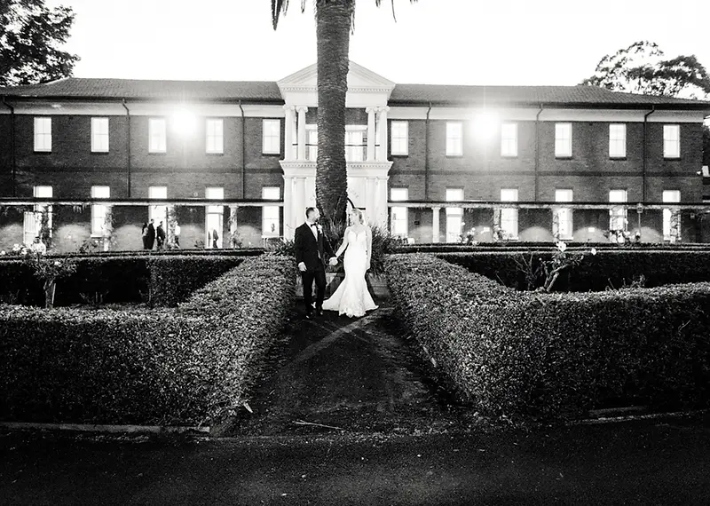 Tahnee and Lachlan celebrating their love on the lawn of the historic Cropley House wedding venue