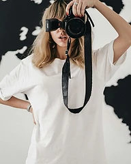 Jen, second shooter wedding photographer at Dreams Photography Sydney, holding her DSLR camera