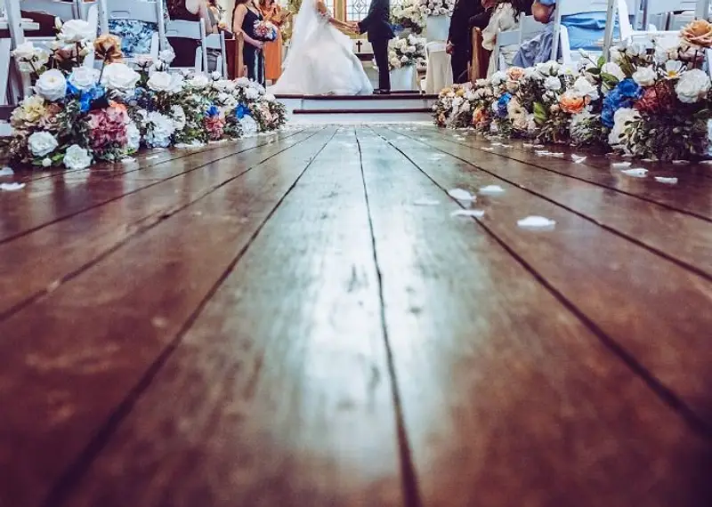 Melinda and Brandyn embracing in front of the historic architecture at their Lords Estate wedding in Sydney