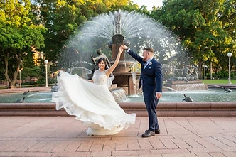 A peaceful garden wedding ceremony scene within Hyde Park, Sydney CBD